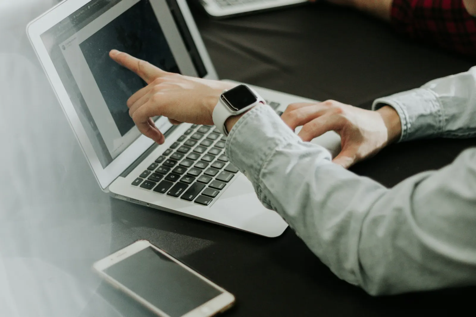 Reviewing a website build together on a laptop